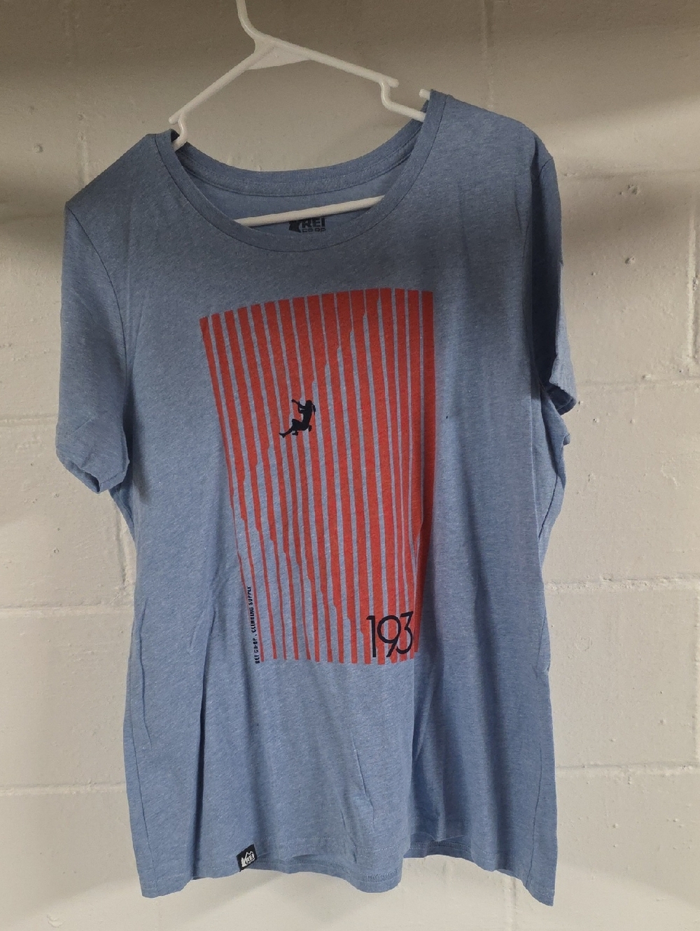 REI Light Blue Short Sleeve Tee with Red Vertical Graphic